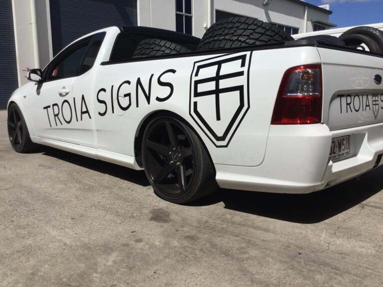 Falcon ute with 20-inch staggered KMC District wheels in satin black