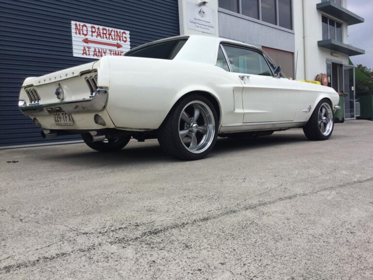 Ford Mustang with 18-inch staggered Rev Classic wheels in gunmetal with machined lip