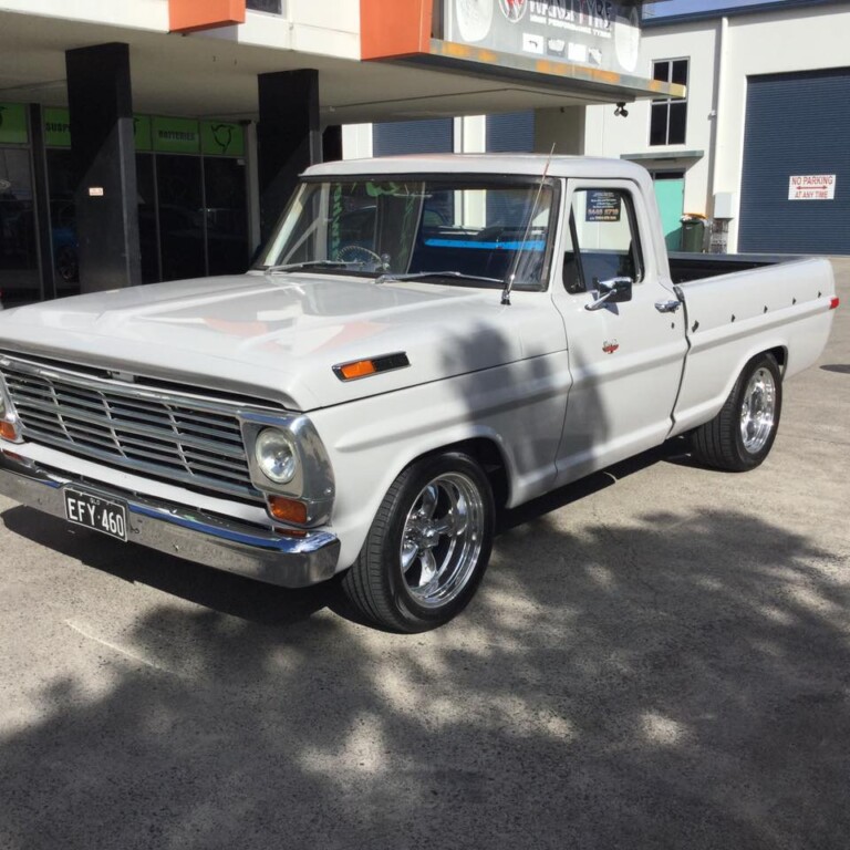 Ford pickup with American Racing Torq Thrust wheels in custom fitment and Nexen N'Fera RU1 tyres