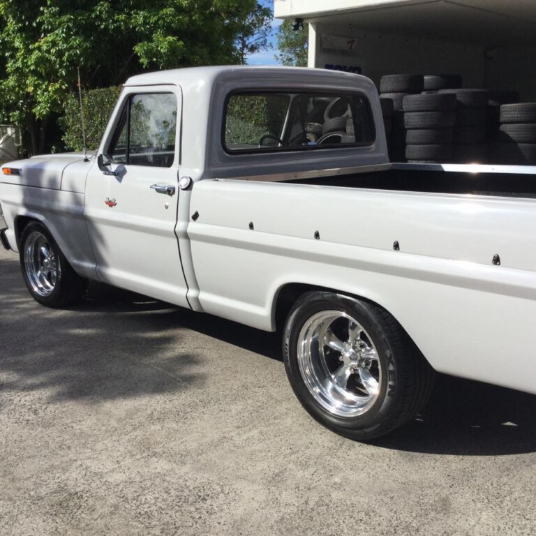 Ford pickup with American Racing Torq Thrust wheels in custom fitment and Nexen N'Fera RU1 tyres