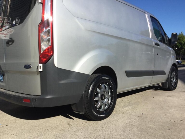 Ford Transit van with 16-inch Moto Metal wheels in two-tone gunmetal with black lip