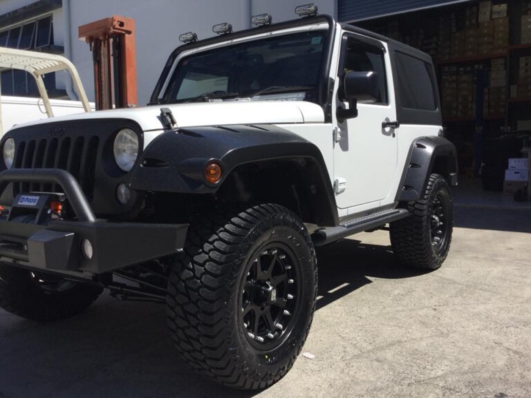 Jeep Wrangler with 17-inch KMC Addict wheels and 305 wide Amp Terrain Gripper tyres