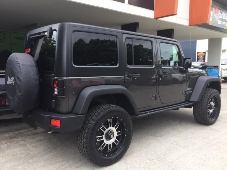Lifted Jeep Wrangler with 20-inch KMC Riot wheels and Nitto Terra Grappler tyres
