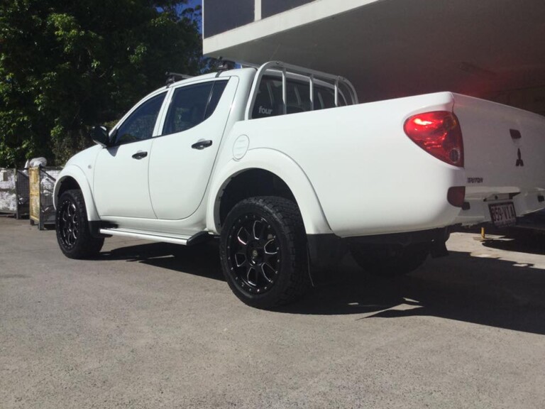 Mitsubishi Triton with 20-inch American Racing Ammo wheels in black with milled edge