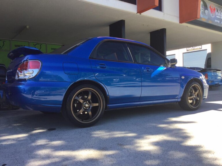 Subaru WRX with 18-inch Motegi Traklite wheels in bronze