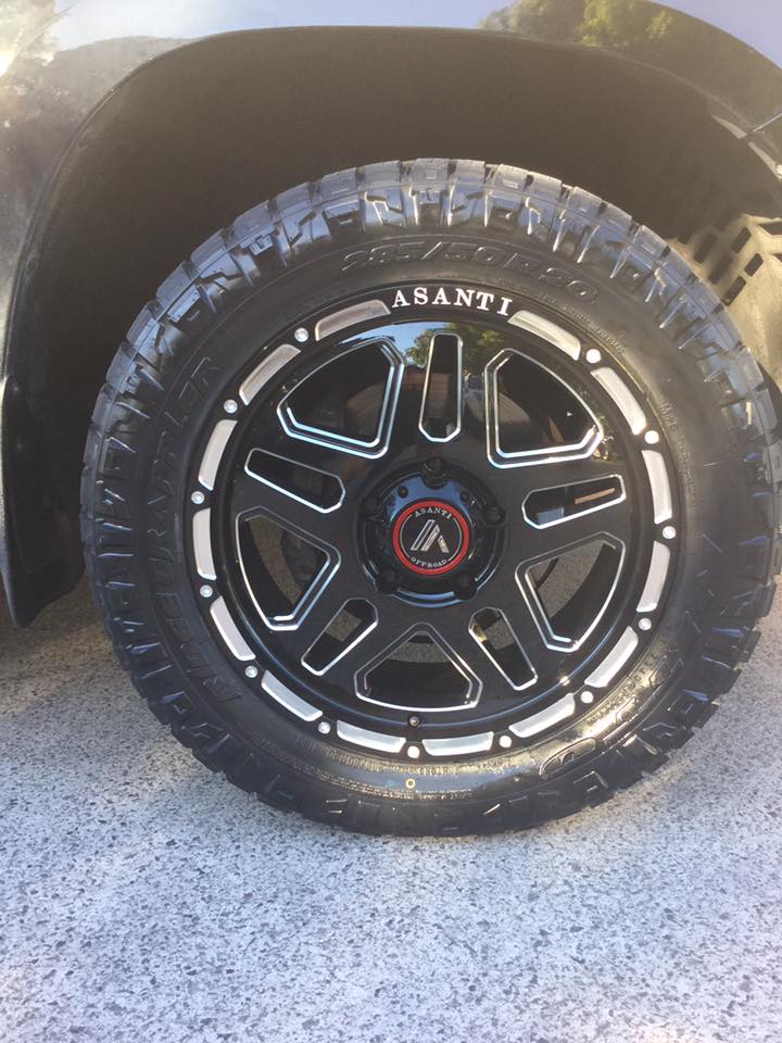 Toyota LandCruiser with Asanti AB-809 wheels in black and Nitto Ridge Grappler tyres
