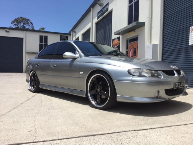 VX Commodore with staggered 20-inch Simmons FR wheels in gloss black with machined lip